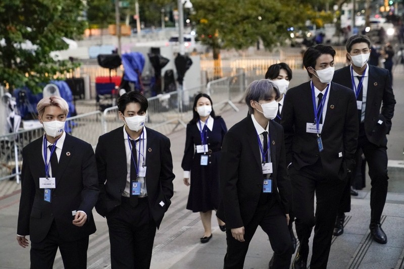 Members of the South Korean band BTS, from left, J-Hope, Jung Kook, Suga, Jimin, partially obscured, Jin and RM arrive to security check-in at United Nations headquarters, Monday, Sept. 20, 2021, during the 76th Session of the U.N. General Assembly in New York.(AP/PTI Photo)
